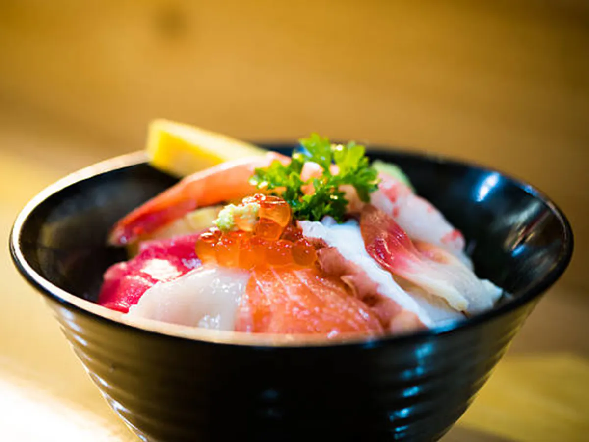 Chirashi don rice bowl topped with assorted sashimi, salmon roe and parsley at Aji Izakaya Rosenberg, a Japanese Restaurant in Rosenberg